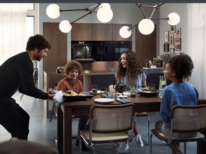 Family eating dinner around the table