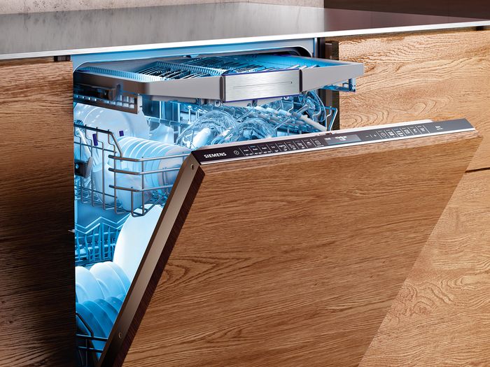 Siemens built in dishwaser with door ajar and emotionlight lighting dishwasher interior