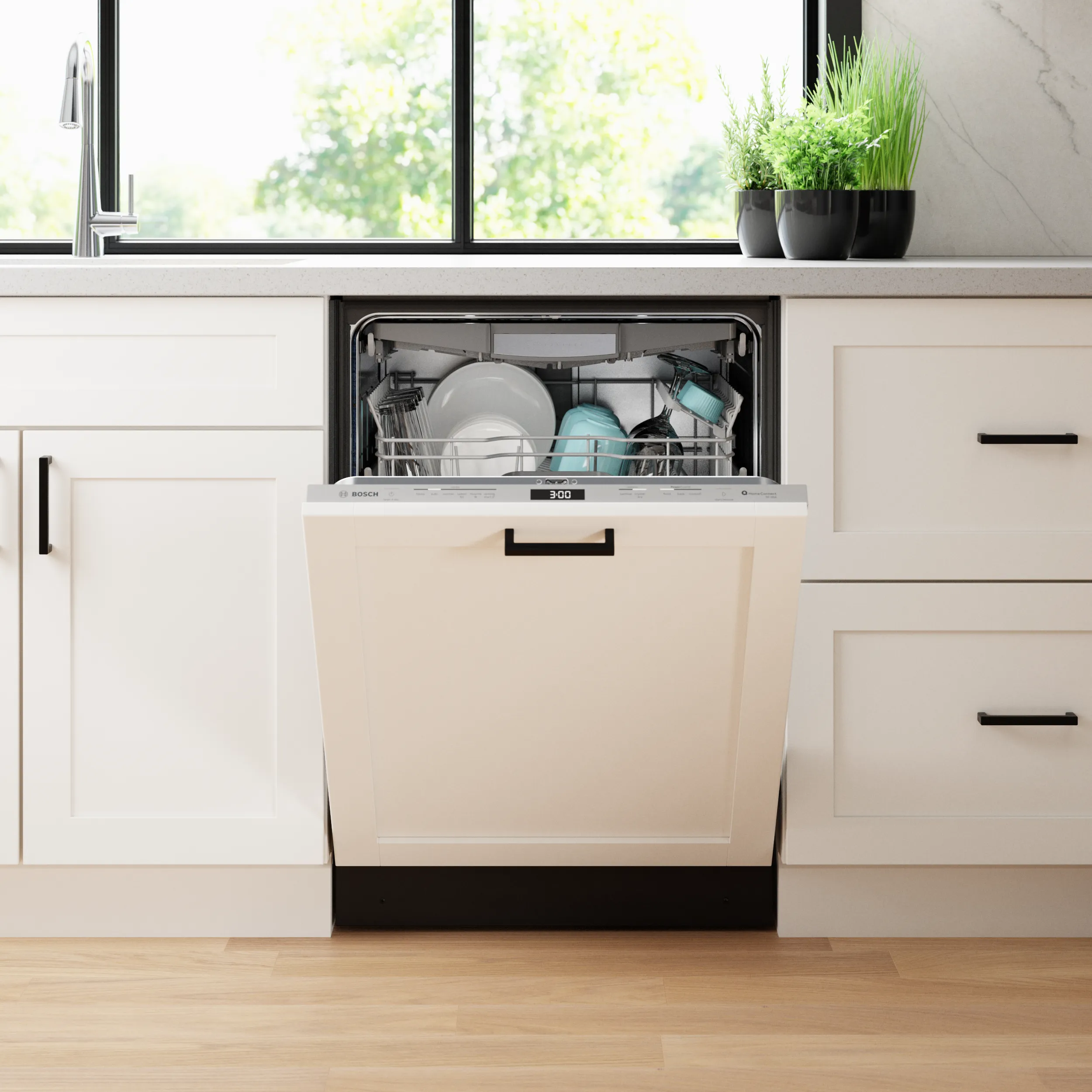 Open Bosch white custom panel dishwasher in a modern kitchen with white cabinets and clean dishes inside.