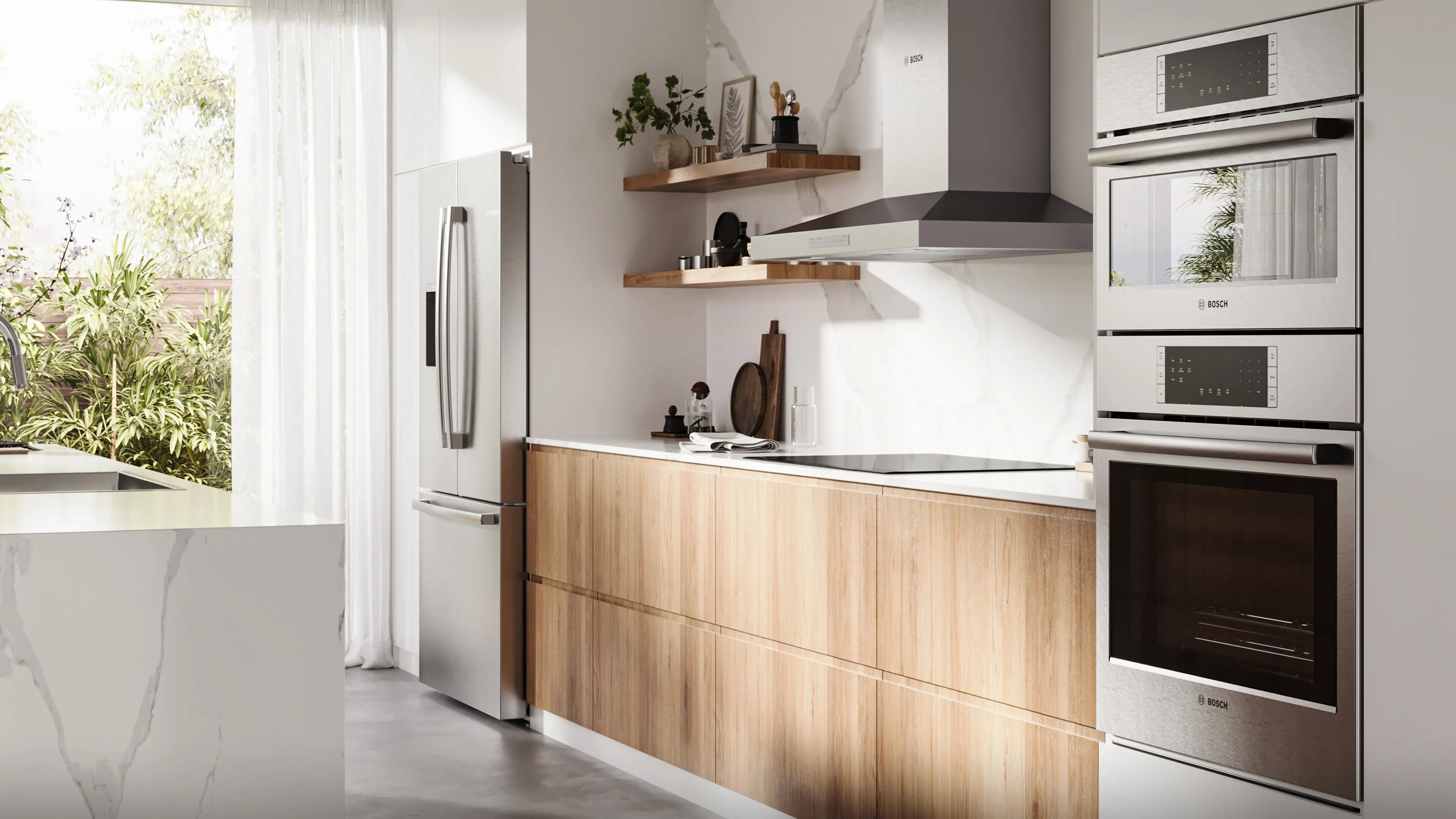 Modern white kitchen with wood island, stainless steel appliances, open shelves, and a bright garden view.